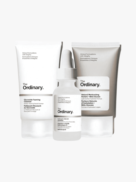 The Ordinary Acne Set in white and brown components on a light gray background
