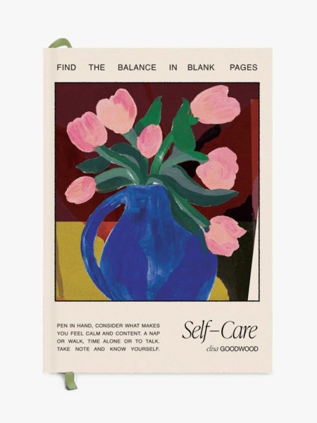 Papier Wellness Journal notebook with a painting of pink tulips in a blue vase on it on light gray background