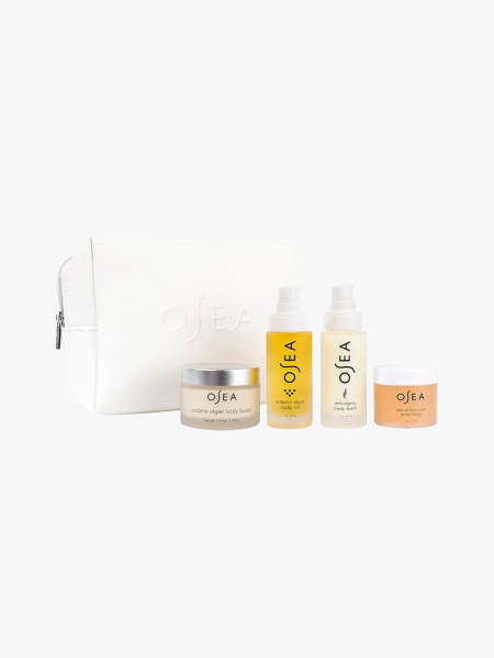 Osea Bestsellers Body Set white makeup bag and mini body care products on light gray background