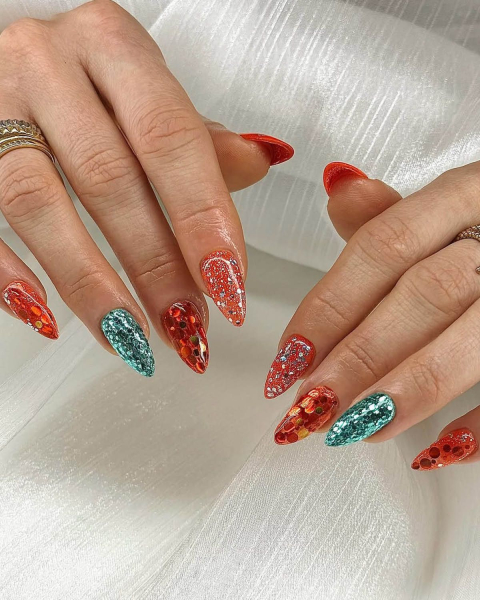 taylor swift tloas nails  orange and blue glitter